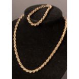An Italian 9k yellow gold ropetwist necklace and closely matched bracelet, approximately 16.