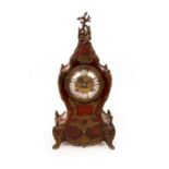 A gilt metal mounted tortoiseshell cased eight-day mantel clock, with segmented enamel chapter ring,