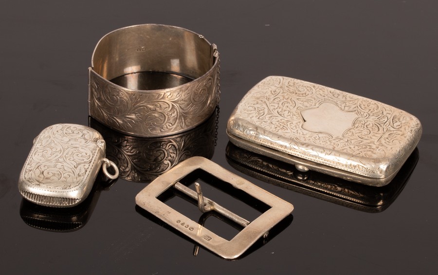 An engraved silver vesta case, Birmingham 1901, an engraved silver cigarette case,