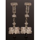 A pair of late Victorian silver candlesticks of 18th Century design, ED, London 1898,