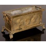 A brass rectangular jardinière, the sides repoussé decorated with dolphins and shells, lead lined,