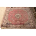 A large Sivas carpet, Anatolia, mid 20th Century, bordered and figured to a pink field,