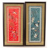 Two framed Chinese embroidered cuffs, one red, one teal, the largest 62cm x 26.