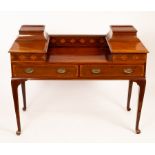 An Edwardian mahogany table with drawers to the two sides and frieze,