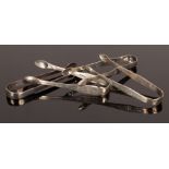 Four pairs of George III silver sugar tongs, one by Samuel Godbehere, Edward Wigan & James Boult,