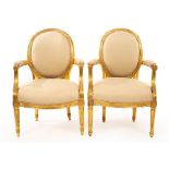 A pair of Louis XIV style armchairs with carved and moulded giltwood frames/see illustration