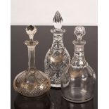 Three cut glass decanters with three plated wine labels and a silver wine label CONDITION