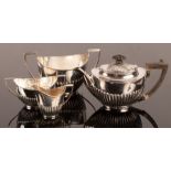 A bachelor's silver tea set, the teapot Mackay & Chisolm, Edinburgh 1905,