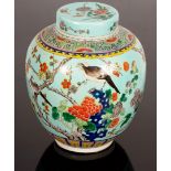 A 20th Century Chinese ginger jar and cover, decorated birds and insects in flowering branches,