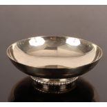 A circular silver bowl, Page, Keen & Page, London 1934, on a low foot with a gadrooned rim, 20.