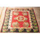 A Karabagh kilim carpet with all over stylised floral design,