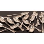 A matched set of fourteen Hanoverian pattern silver table spoons, various dates and makers,