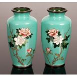 A pair of cloisonné vases decorated flowering peonies on turquoise ground, 9cm high,