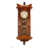 A Vienna eight-day regulator wall clock in a walnut case,