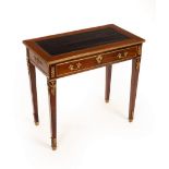 A Louis XVI style French writing table with gilt metal mounts, raised on square legs,
