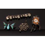 A novelty scarf clip of butterfly form, set in turquoise and with gem set eyes, 3cm wide,