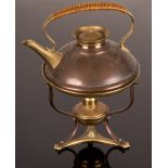 A WAS Benson copper and brass kettle with rattan handle on tripod stand with burner,