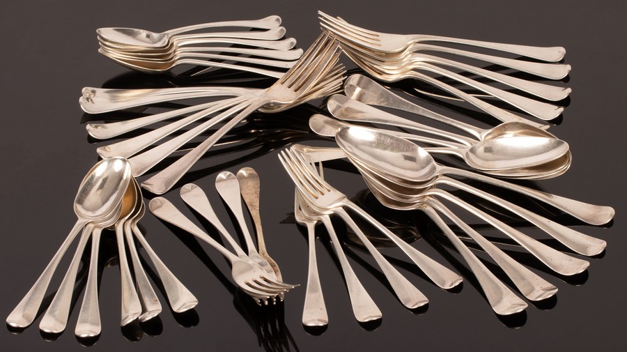 A matched set of Georgian and later Hanoverian pattern silver flatware, comprising nine tablespoons,