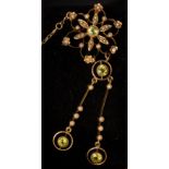 An Edwardian peridot and seed pearl brooch, set in 15ct yellow gold,