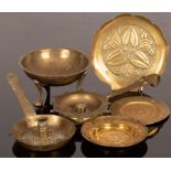 A group of brass including chambersticks, three small plates and a bowl on three paw feet, etc.