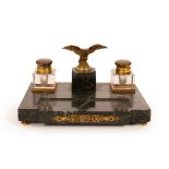 An Empire style inkstand with eagle surmount, on a veined marble base,