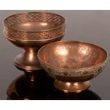 A copper pedestal bowl with pierced border,