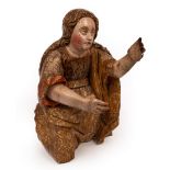 A 17th Century carved and polychrome figure of Mary Magdalene, kneeling with outstretched arms,