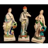 Three Staffordshire pearlware figures, two of Venus with Cupid beside a dolphin and one of Neptune,