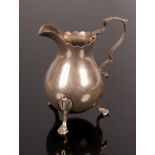 A George III helmet-shaped silver cream jug, Andrew Fogelberg, London 1779,