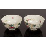 A pair of 20th Century Chinese famille rose porcelain bowls, decorated melons and foliage,