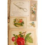 A late 19th Century album containing a quantity of greeting cards, scraps and postcards,