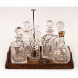 A cut glass decanter and stopper with silver mounts, 30cm high,