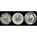 Two English blue and white Delftware chargers and a Dutch example, one with white foliate border,