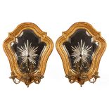 A pair of gilt framed girandoles of cartouche shape,