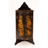 A 19th Century lacquered bowfronted floor standing corner cabinet/Provenance: The Estate of Anthony