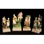 Four pearlware figure groups of rural folk on lined square bases,