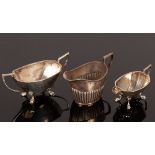 A half-ribbed silver cream jug, Chester 1899, a two-handled sugar basin and matching cream jug,