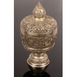 An Eastern white metal covered bowl with stand, embossed warriors riding horses and elephants,