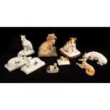 Nine porcelain models of dogs, 19th and 20th Century, mostly Continental, the seated greyhound 12.