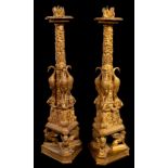 A pair of 19th Century gilt bronze candlesticks after Giovanni Battista Piranesi,