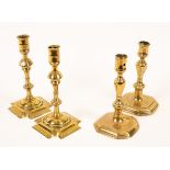 A pair of 18th Century brass candlesticks with baluster stems and octagonal bases,