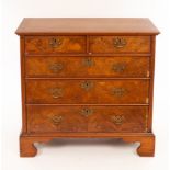 An early 18th Century walnut chest of three long and two short drawers, the fronts cross banded,