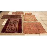 A Bokhara rug on red ground, ivory details with stepped border, 130cm x 100cm,