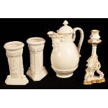 A pair of Victorian Parian cylindrical vases applied trophies on a triangular base,