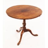A George III mahogany supper table, on turned column and tripod base,