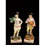 Two pearlware figures of musicians, 23.