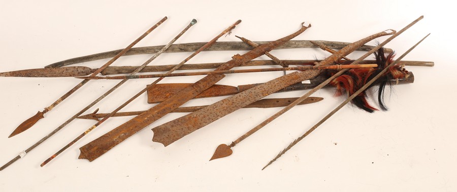 A quantity of tribal weapons, to include a bow, polychrome and barbed arrows, machete and spear,