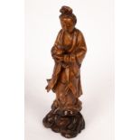 A 19th/20th Chinese Century fruitwood carving of Jingping Guanyin, Longyanmu,