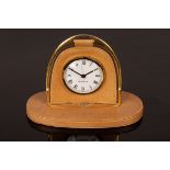 A Gucci travelling clock, the frame in the form of a stirrup,