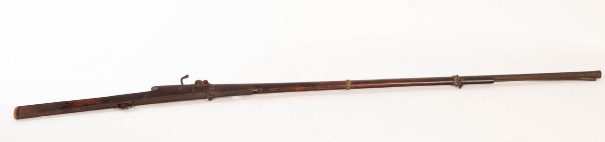 An 18th Century matchlock rifle with a walnut stock and octagonal steel barrel, mount and a ramrod, - Image 2 of 6